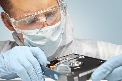 lab-worker-examining-Hard-Drive1.jpg